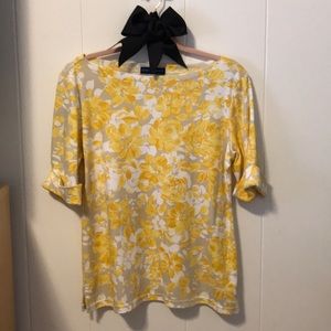 This lovely floral 3/4 sleeve top is a pale yellow